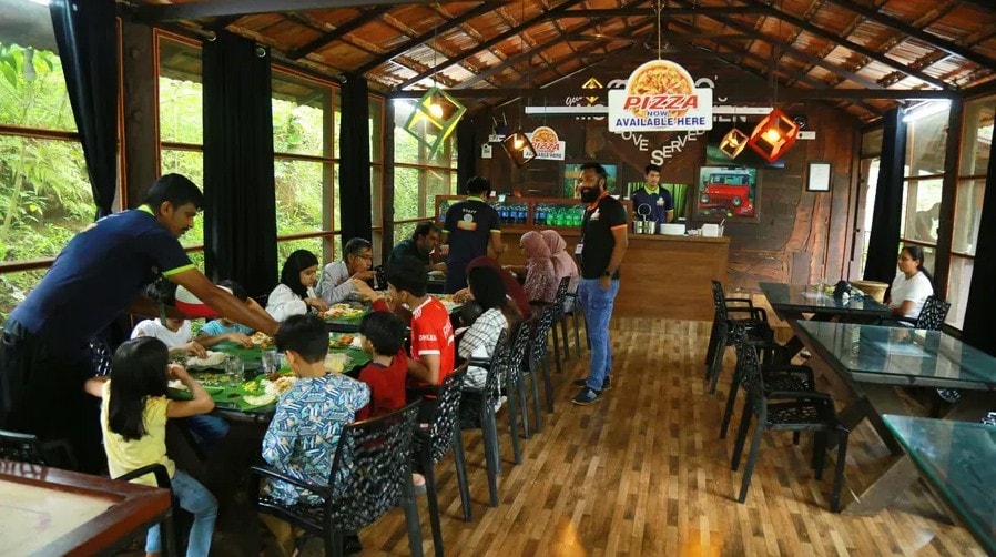 Family dining at Mom's Kitchen restaurant at Holistic Eco-Resort