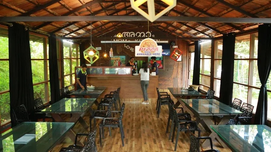 Mom's Kitchen interior with dining tables at Holistic Eco-Resort
