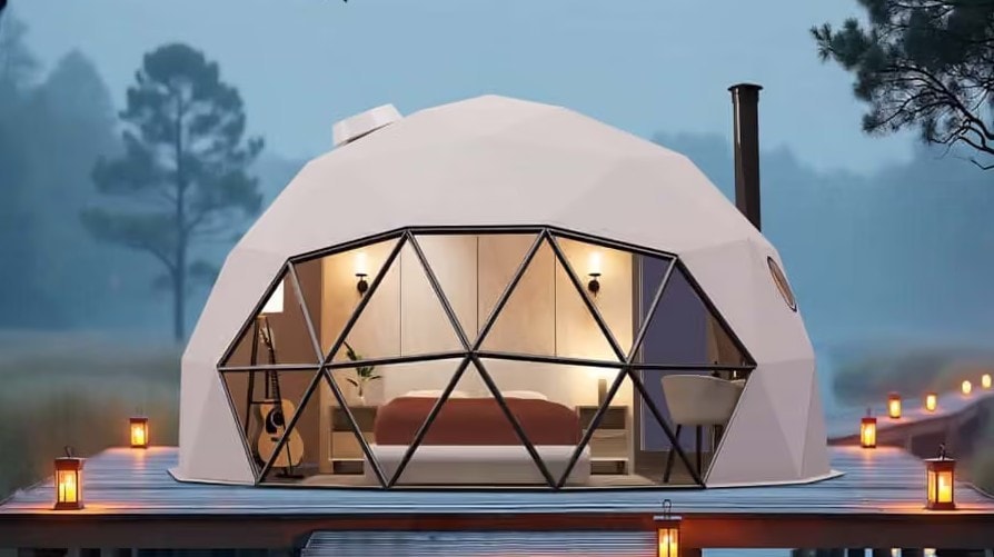 Glass dome exterior with warm lantern lighting at dusk at Holistic Eco-Resort