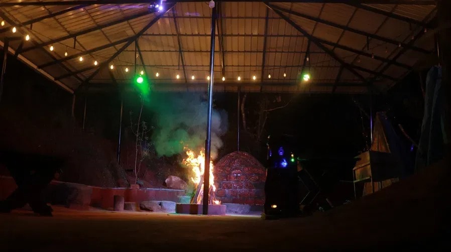 Chill n Grill stage with fire, coloured lights and smoke at Holistic Eco-Resort