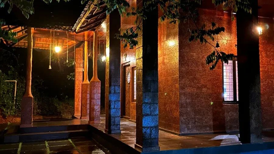 Kerala traditional villa lit up at night
